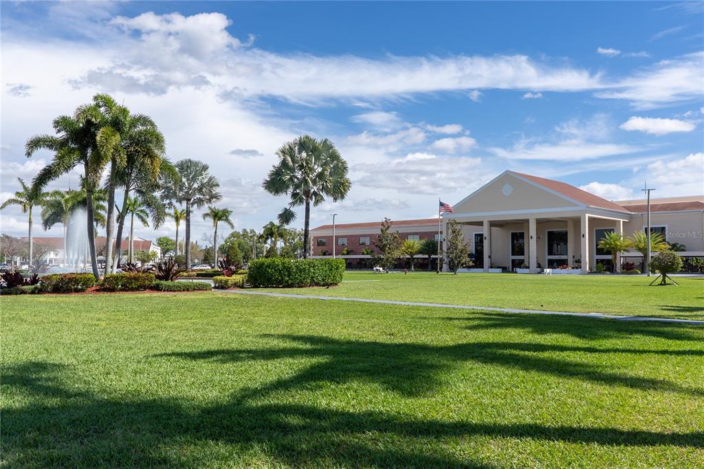 592 Fanshaw O, Unit 592 Boca Raton, FL 33434 - Photo 19 of 25 a front view of a house with a garden