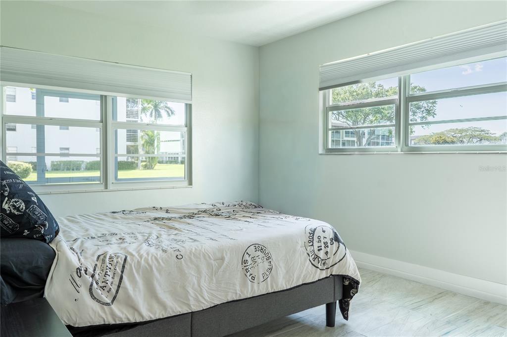592 Fanshaw O, Unit 592 Boca Raton, FL 33434 - Photo 7 of 25 a bedroom with a bed and a window