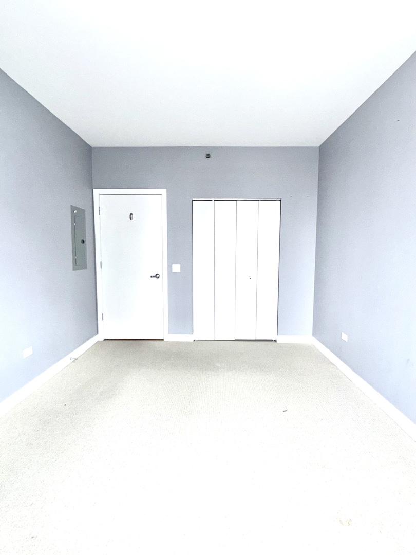 Undisclosed Address Chicago, IL 60601 - Photo 13 of 18 a view of an empty room with a window