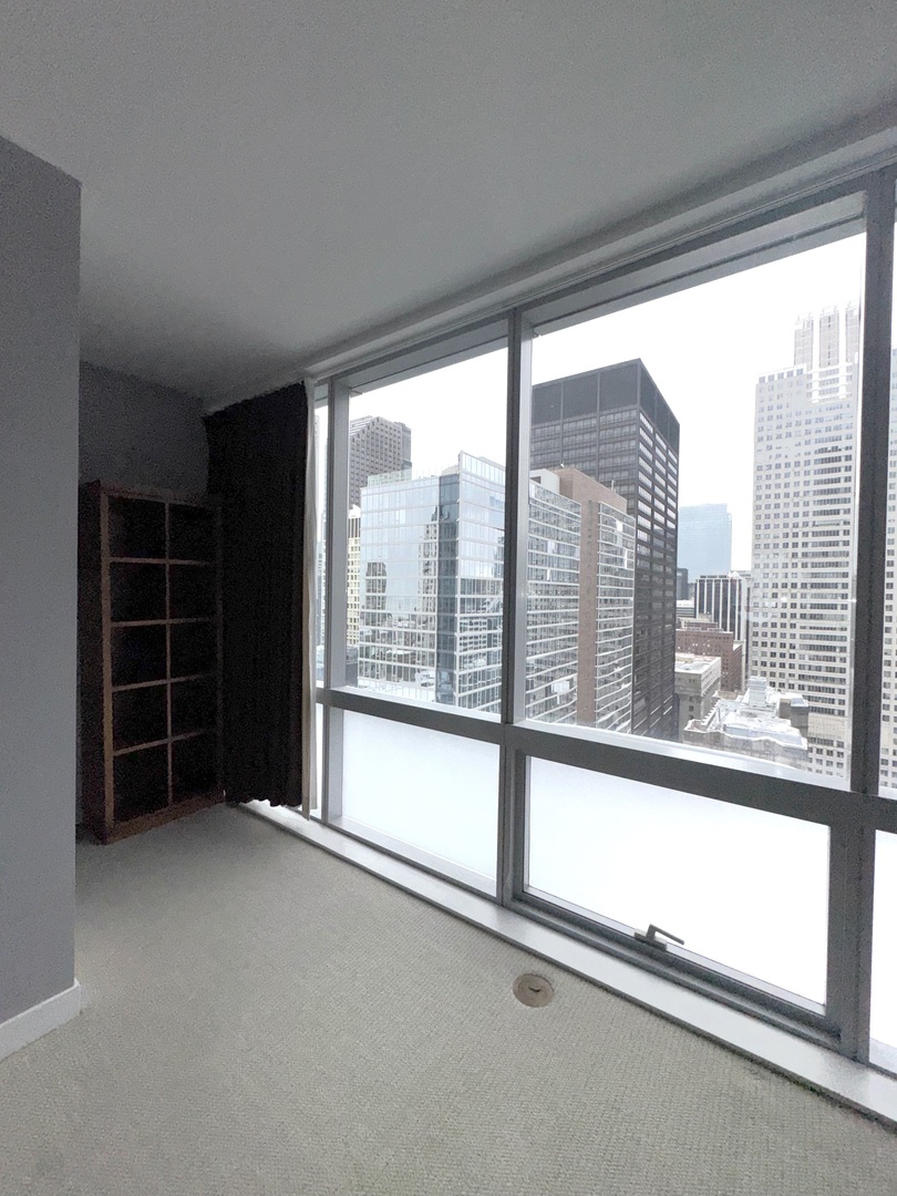 Undisclosed Address Chicago, IL 60601 - Photo 16 of 18 a view of empty room with windows and floor to ceiling window