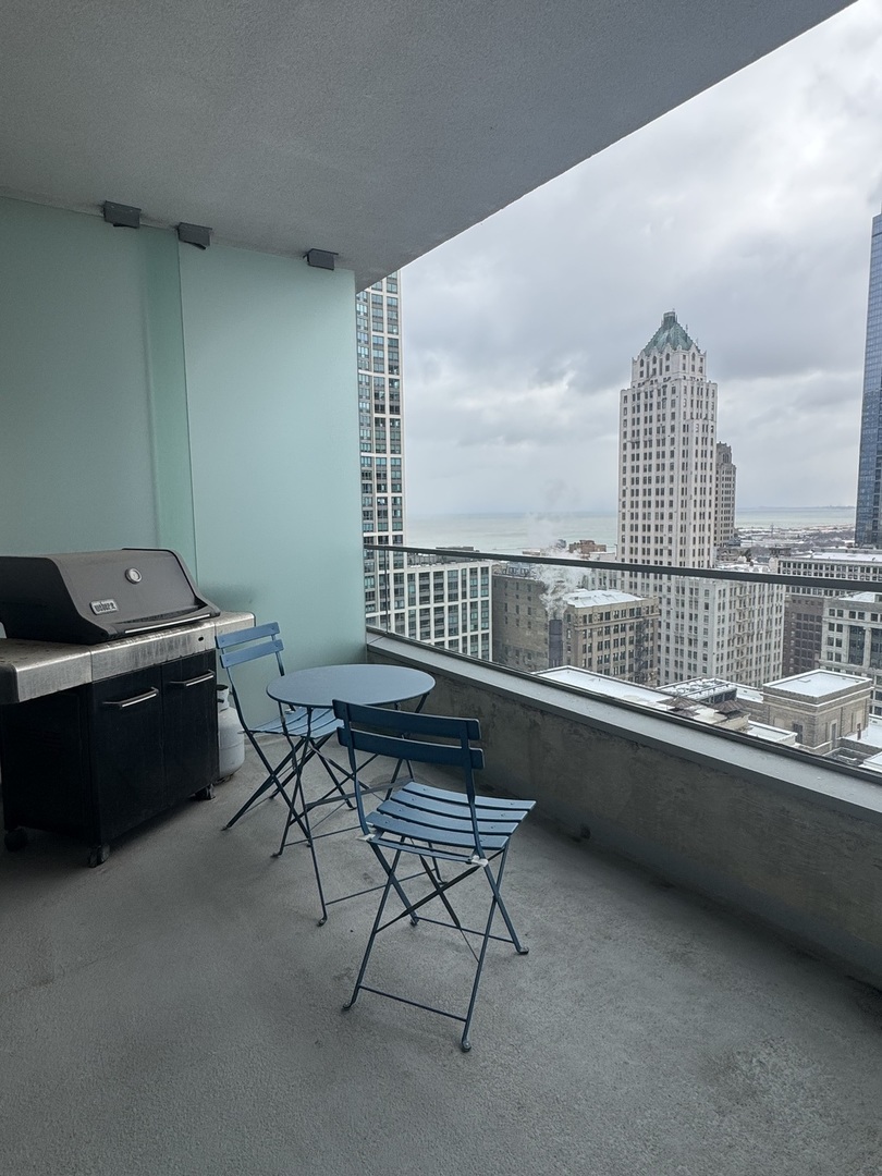 Undisclosed Address Chicago, IL 60601 - Photo 2 of 18 a living room with a couch and a table