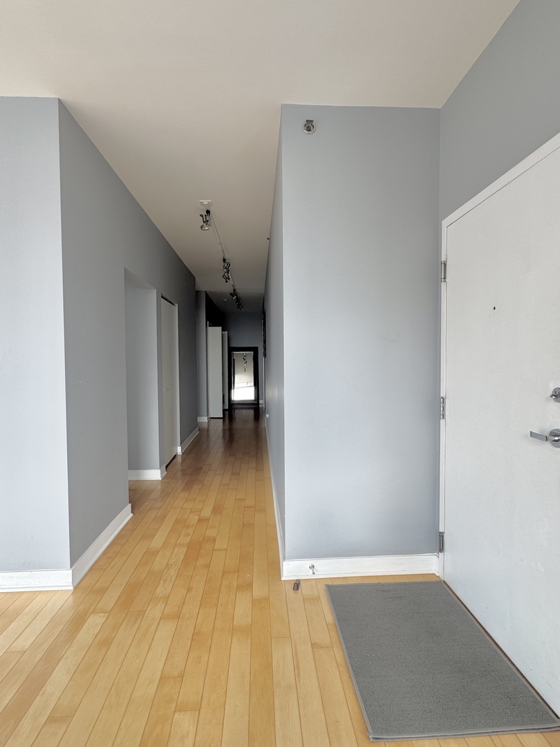 Undisclosed Address Chicago, IL 60601 - Photo 3 of 18 a view of a room with wooden floor