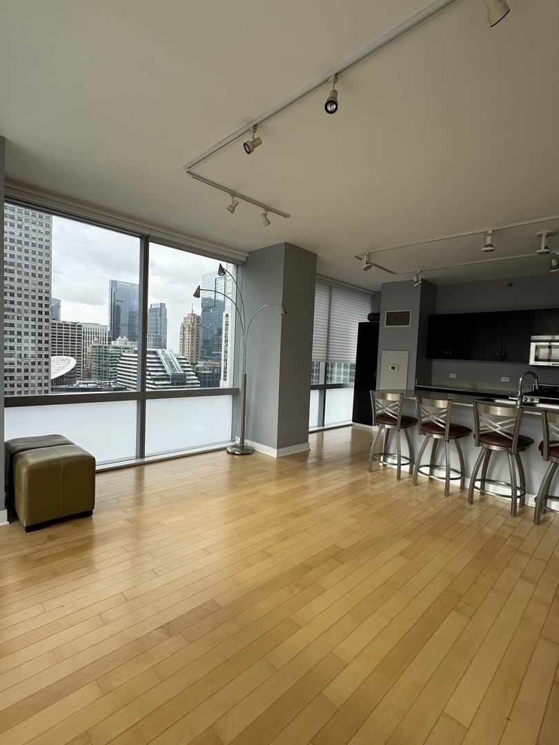 Undisclosed Address Chicago, IL 60601 - Photo 9 of 18 a view of an empty room with furniture and a floor to ceiling window