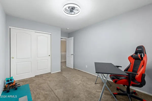 a view of room with lounge chair and wooden floor