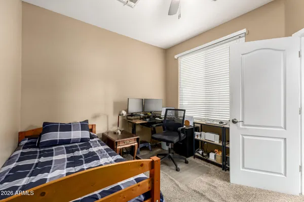 a bedroom with furniture and a window