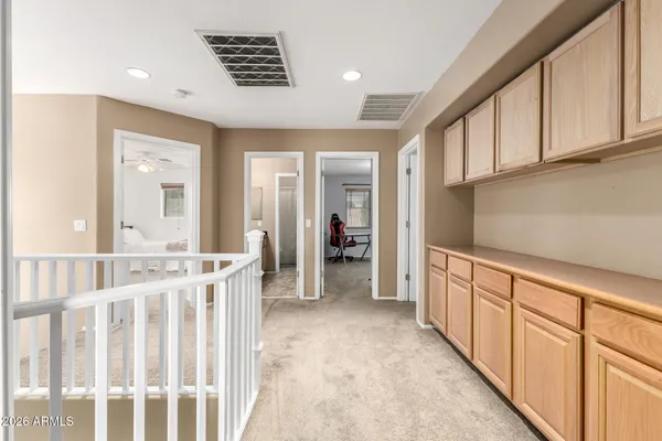 a view of hallway with chandelier