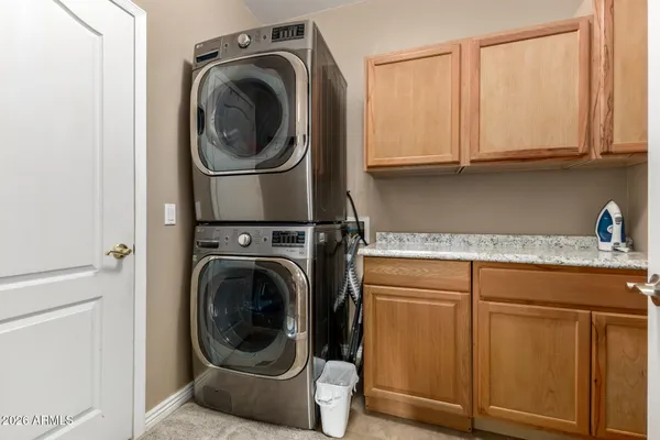 a close view of a utility room with washer and dryer