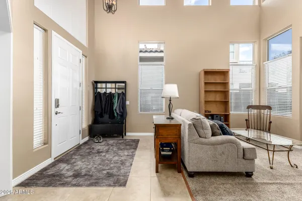 a living room with furniture and a rug