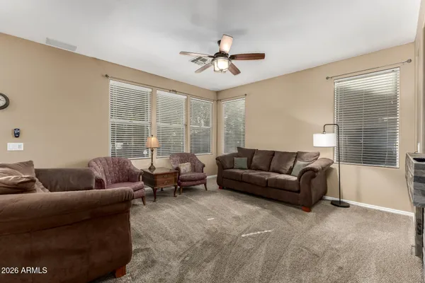 a living room with furniture and a large window
