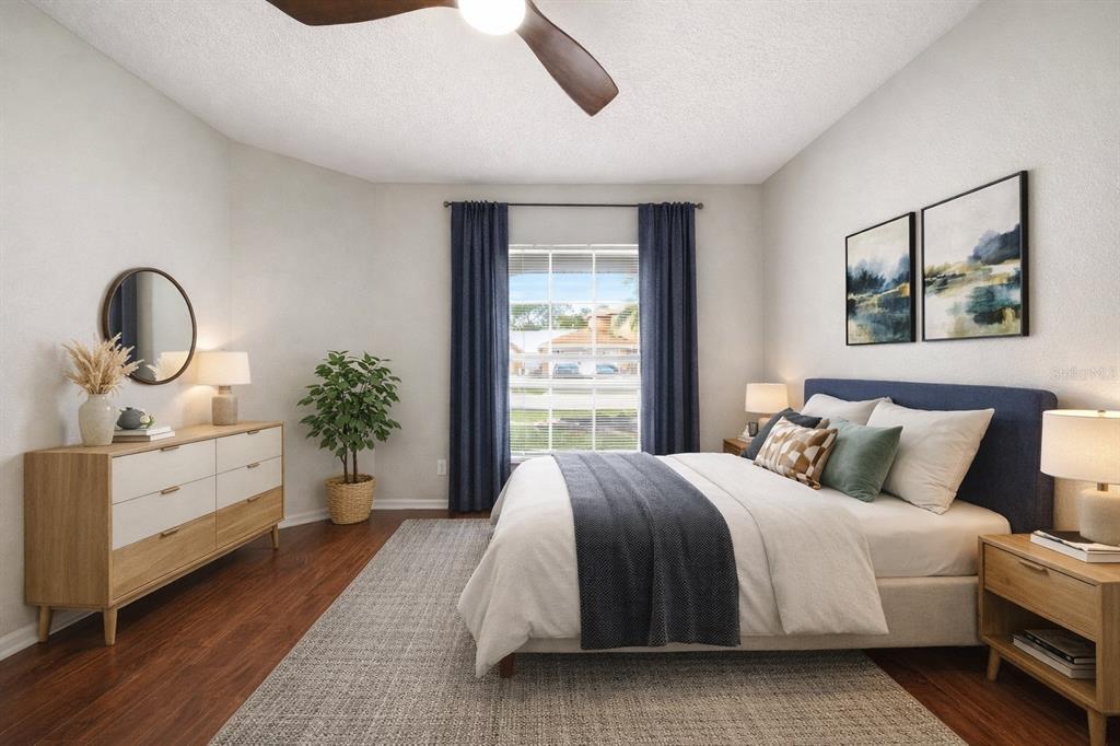 245 Hollinghead Loop Davenport, FL 33896 - Photo 11 of 19 a bedroom with a bed and a dresser