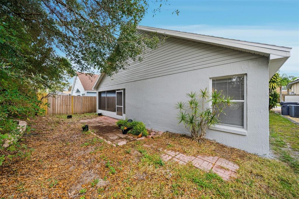 245 Hollinghead Loop Davenport, FL 33896 - Photo 17 of 19 a front view of a house with garden