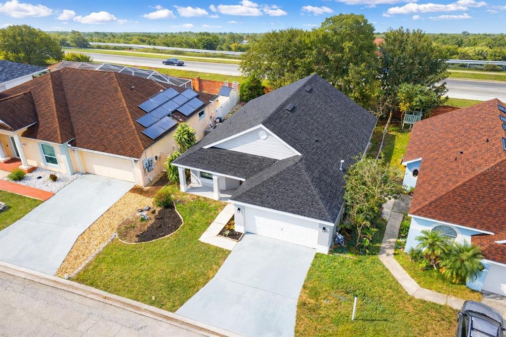 245 Hollinghead Loop Davenport, FL 33896 - Photo 18 of 19 a view of a swimming pool with a lounge chairs