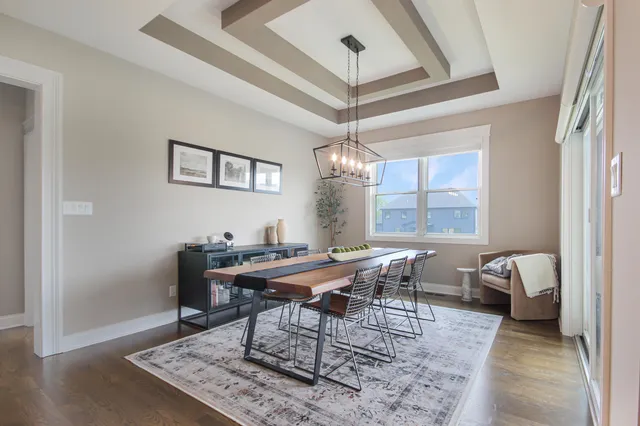 a work room with furniture and a chandelier