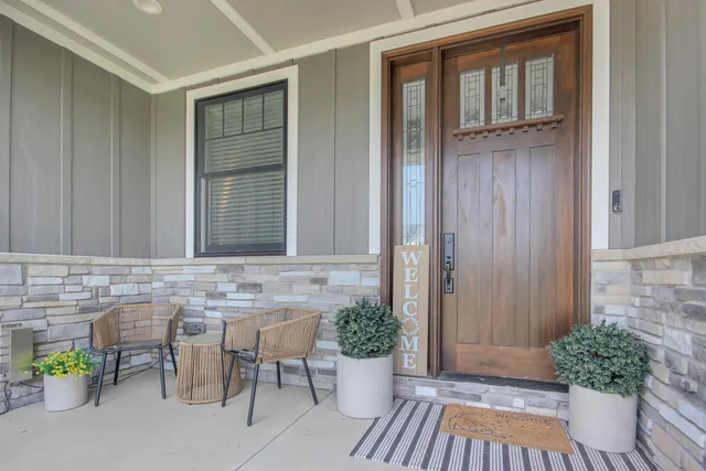 a view of front door of house with potted plant