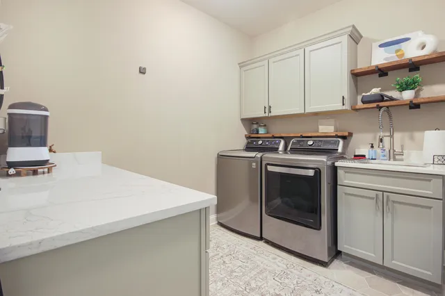 a kitchen with a stove and a sink