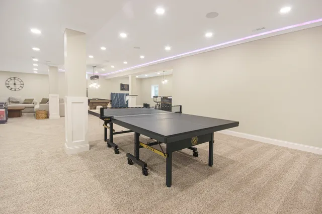 a kitchen with a table and chairs in it