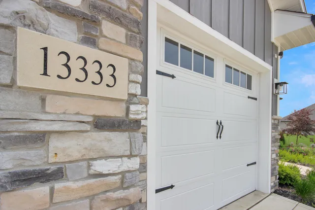 a view of a wooden door and a street sign