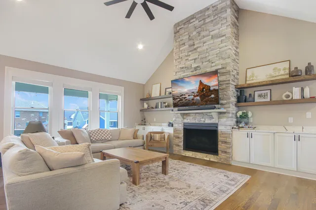 a living room with furniture and a fireplace