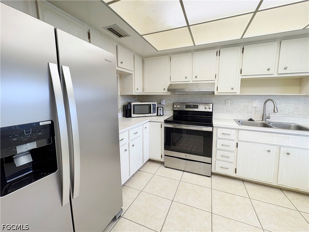 1830 Brantley Road, Unit I7 Fort Myers, FL 33907 - Photo 6 of 34 a kitchen with cabinets stainless steel appliances and a counter space
