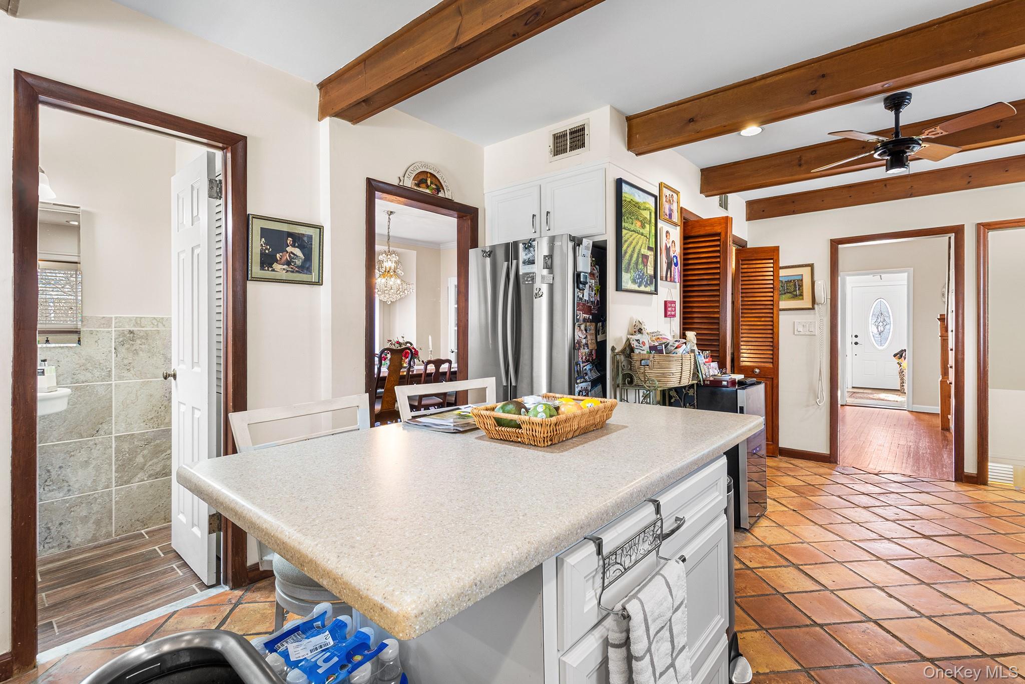 46 Riggs Place Locust Valley, NY 11560 - Photo 17 of 29 a view of kitchen island a sink and living room view