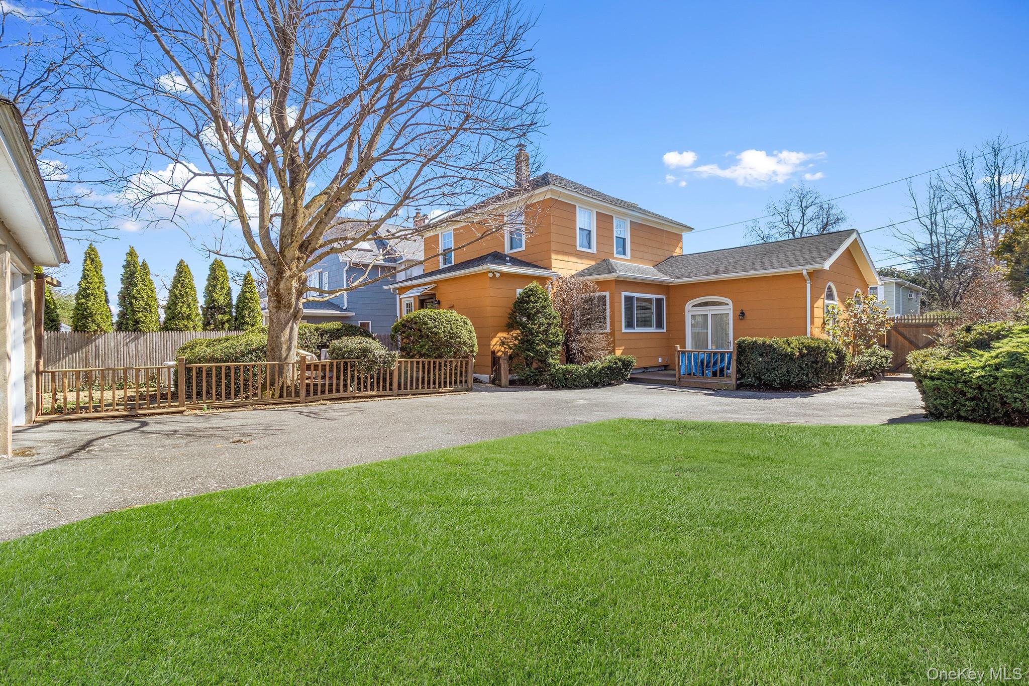 46 Riggs Place Locust Valley, NY 11560 - Photo 2 of 29 a view of a yard in front of house