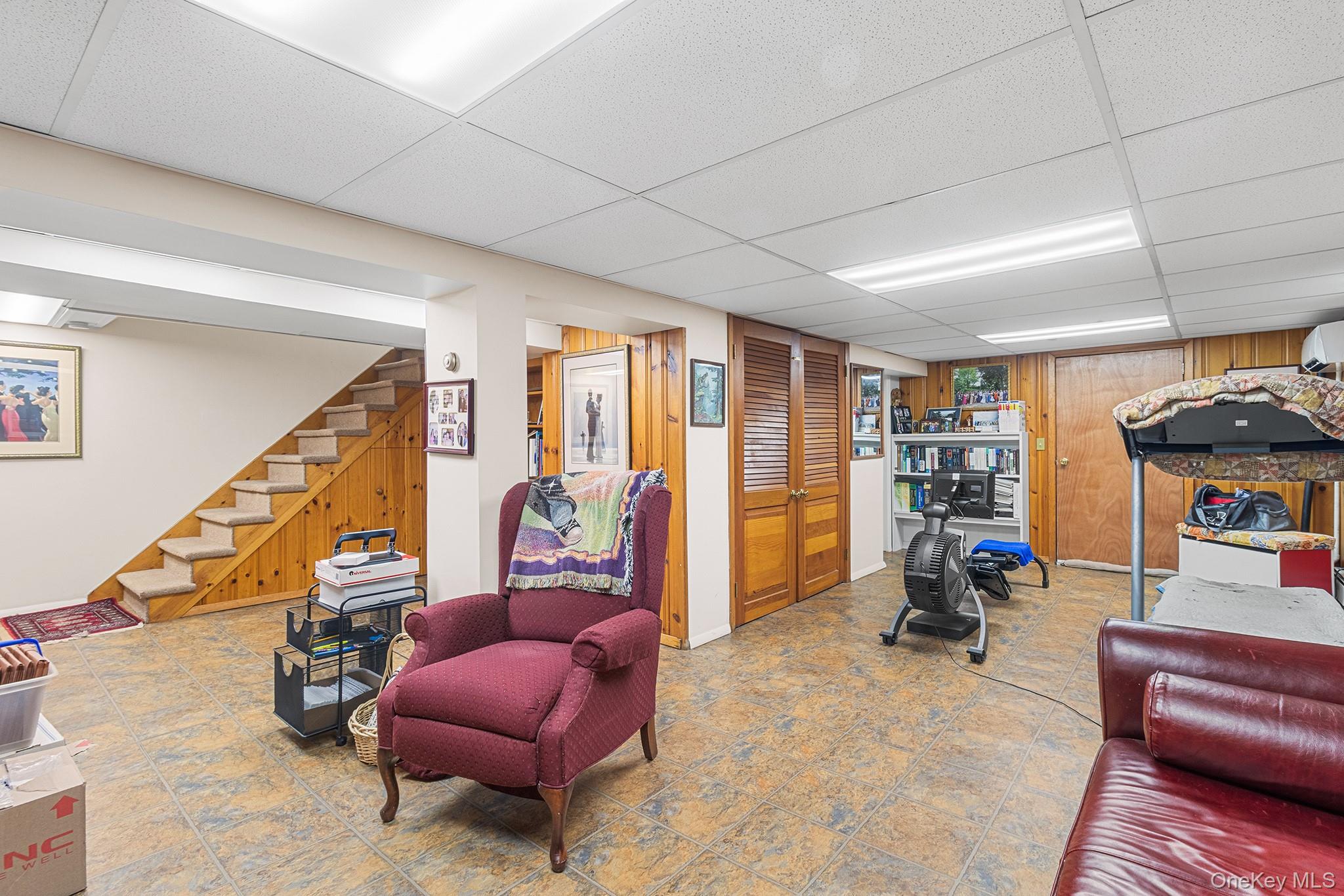 46 Riggs Place Locust Valley, NY 11560 - Photo 27 of 29 a living room with furniture and a gym equipment