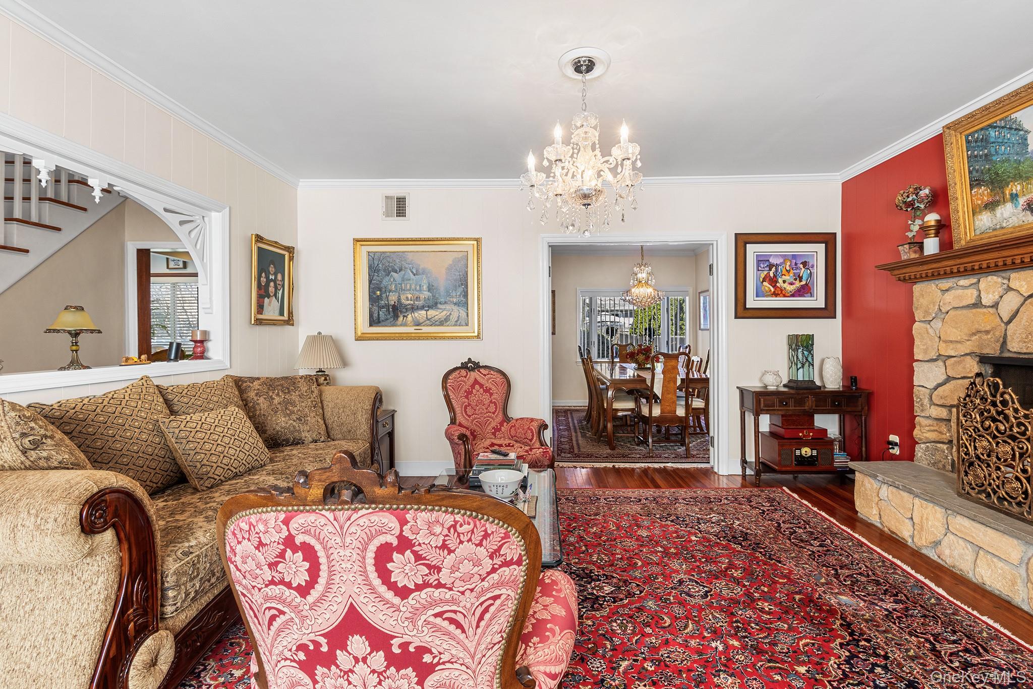 46 Riggs Place Locust Valley, NY 11560 - Photo 5 of 29 a living room with furniture chandelier and wooden floor