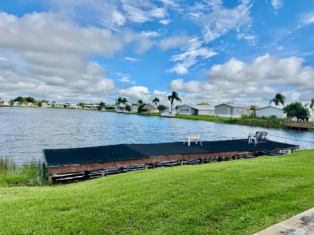 a view of a lake with a yard