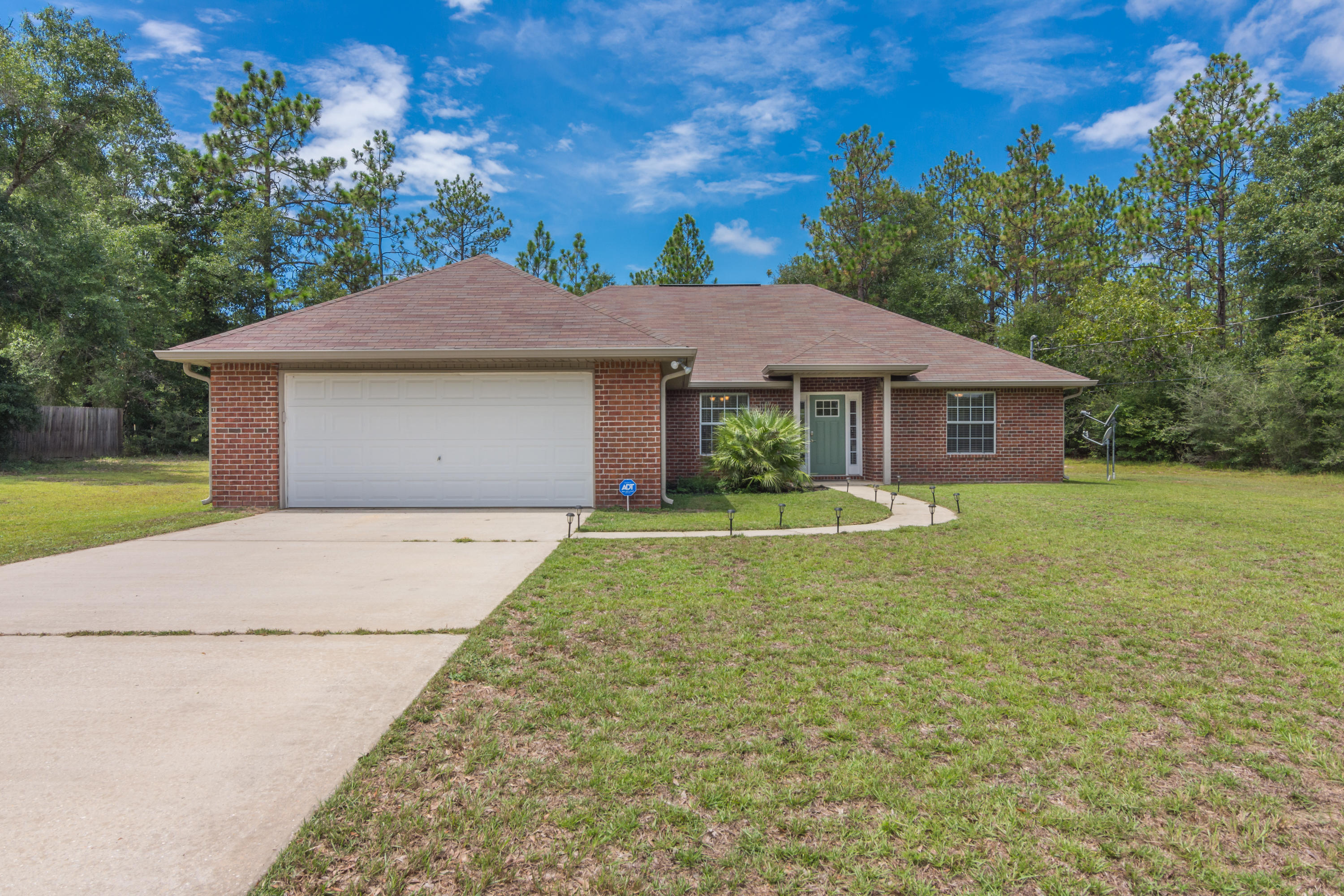 6336 Possum Ridge Road Crestview, FL 32539 - Photo 1 of 40 a house view with a garden space