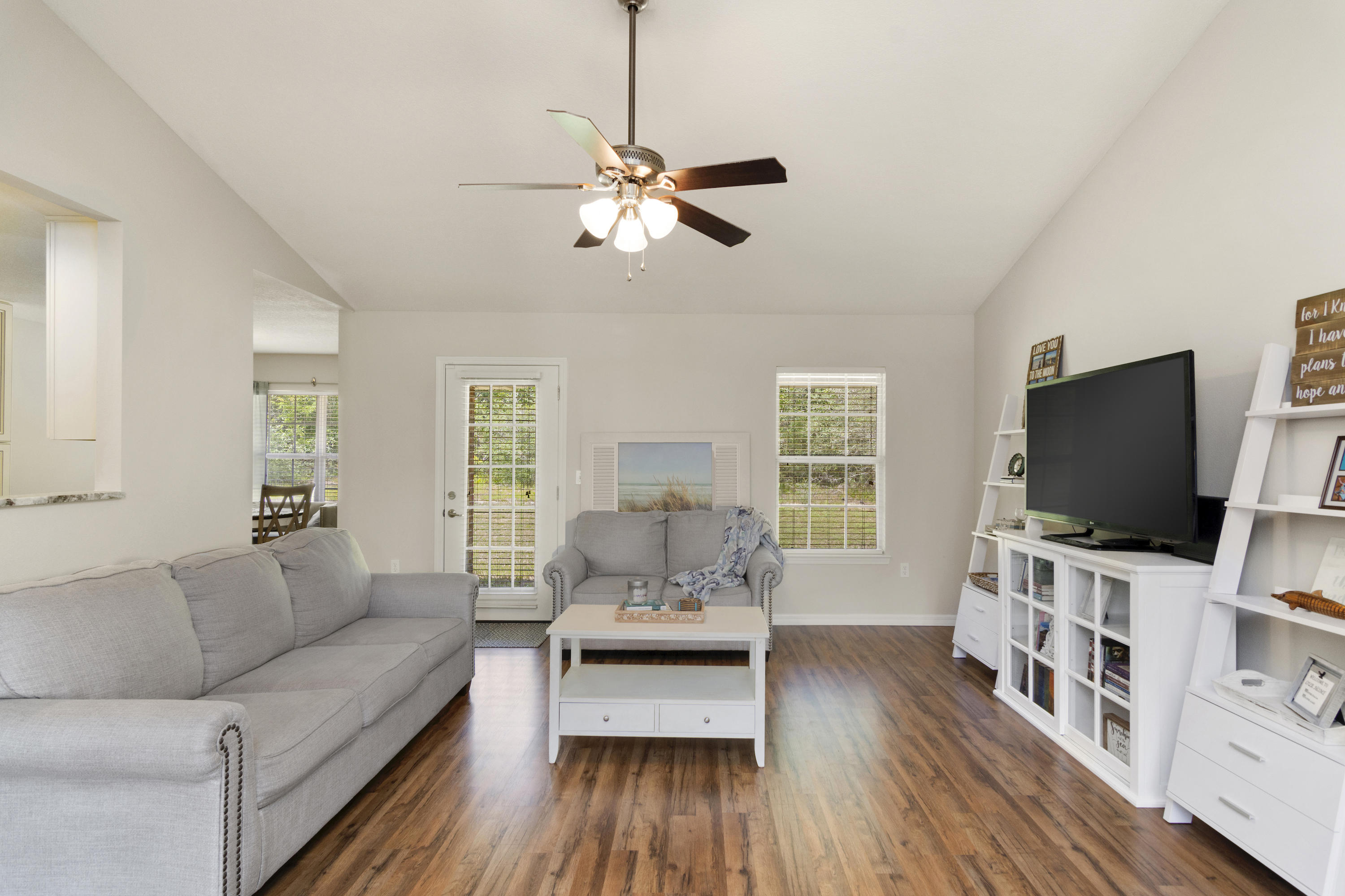 6336 Possum Ridge Road Crestview, FL 32539 - Photo 11 of 40 a living room with furniture and a flat screen tv