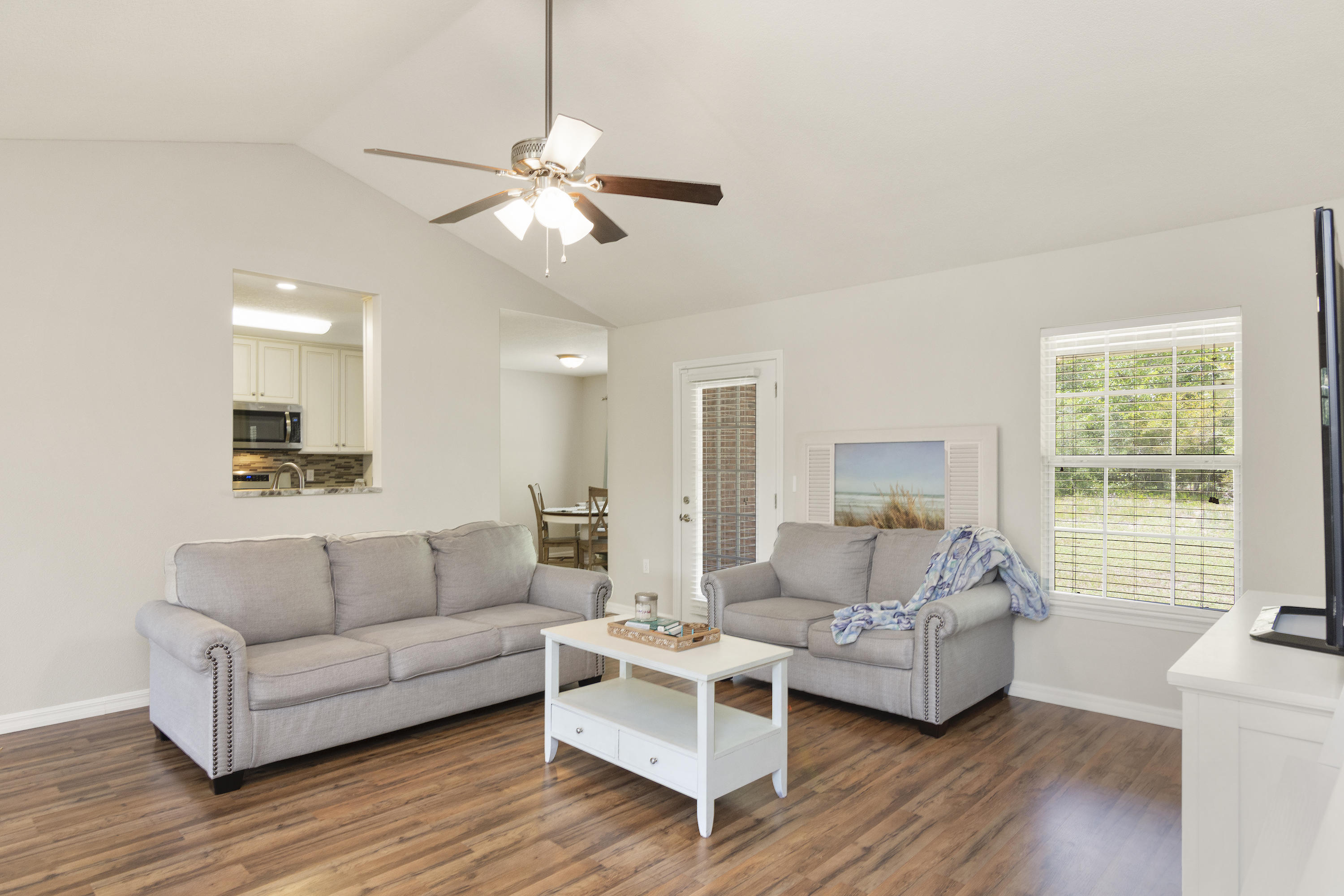 6336 Possum Ridge Road Crestview, FL 32539 - Photo 12 of 40 a living room with furniture and a large window