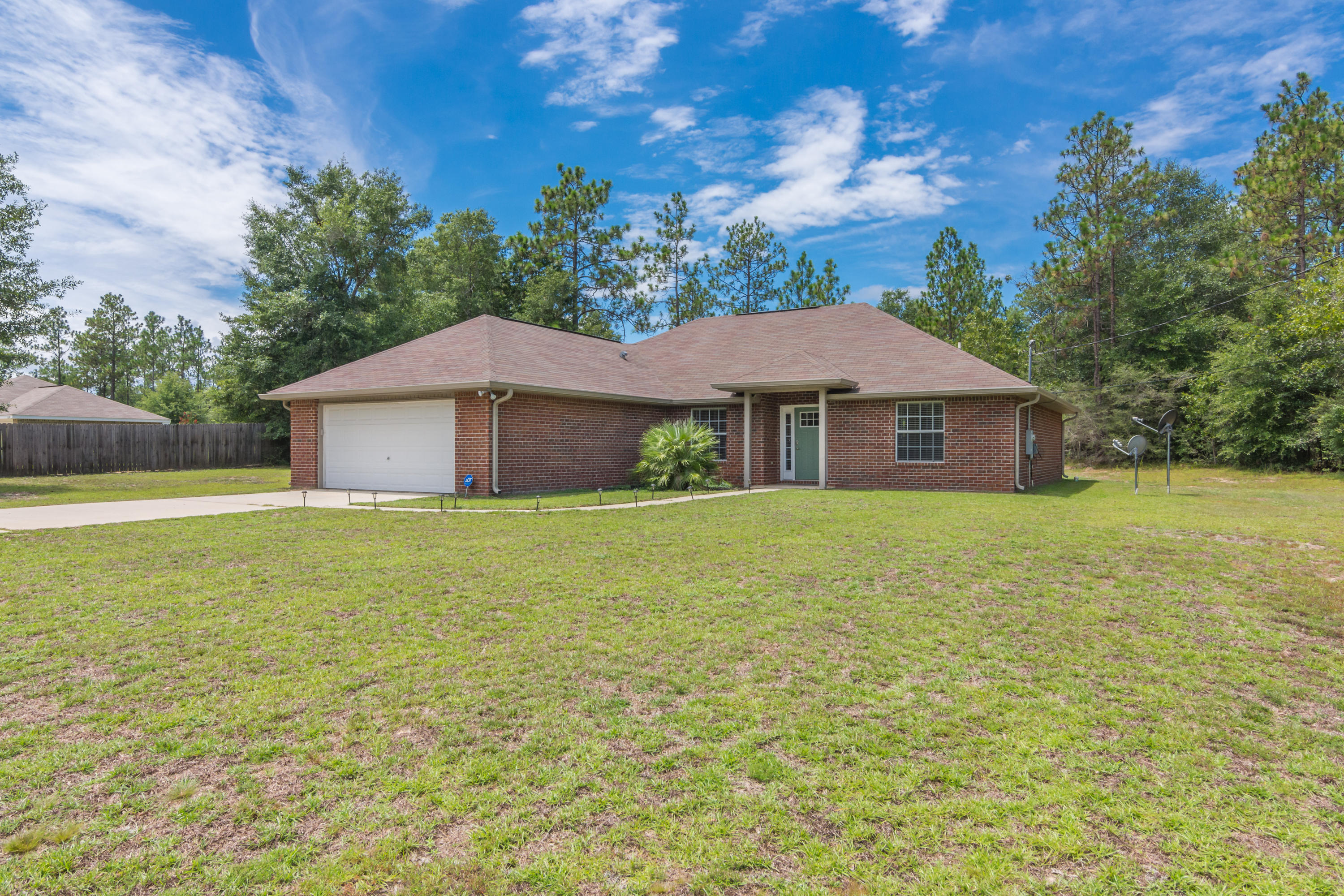 6336 Possum Ridge Road Crestview, FL 32539 - Photo 2 of 40 a house with garden in front of it