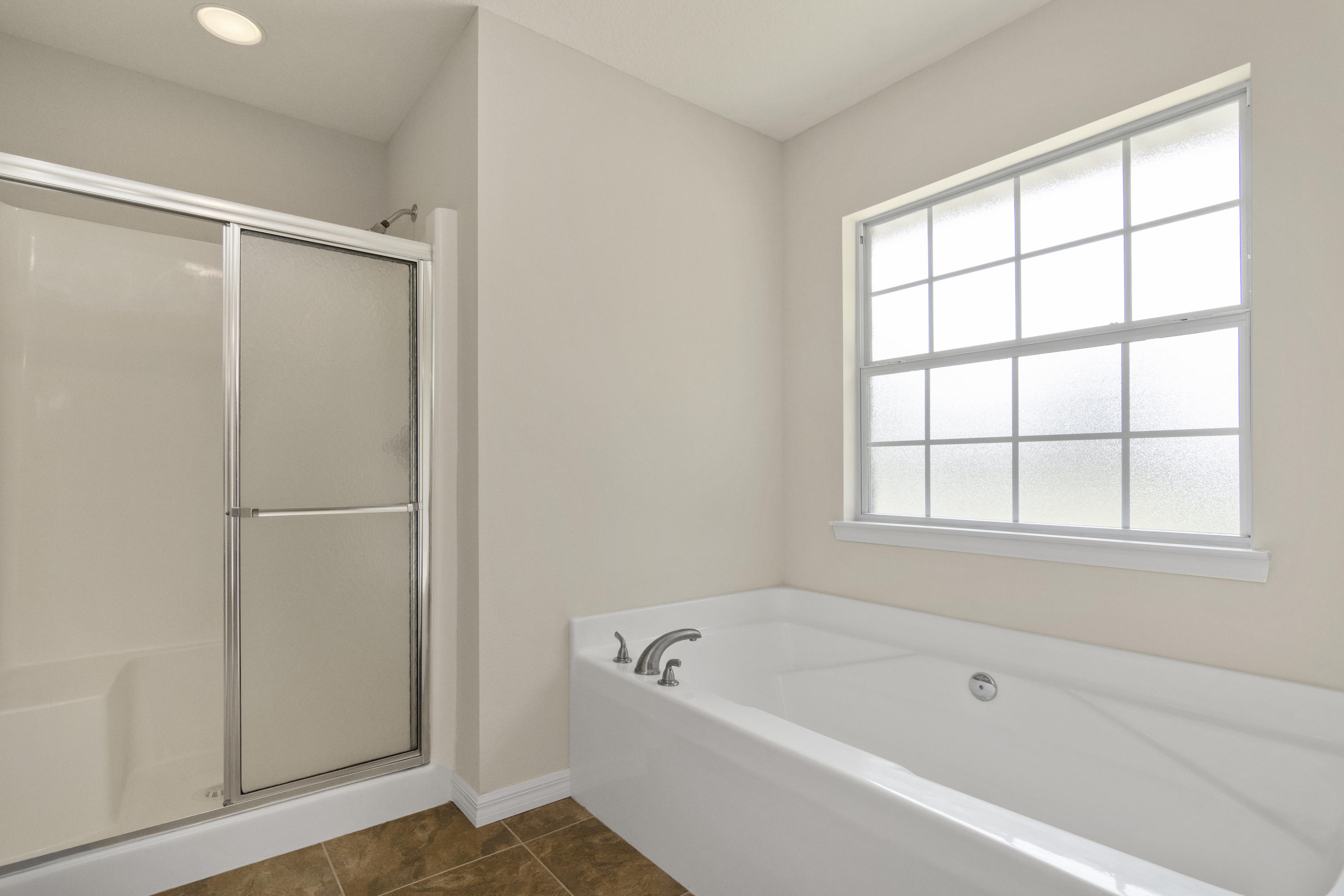6336 Possum Ridge Road Crestview, FL 32539 - Photo 22 of 40 a bathroom with a bathtub and a shower