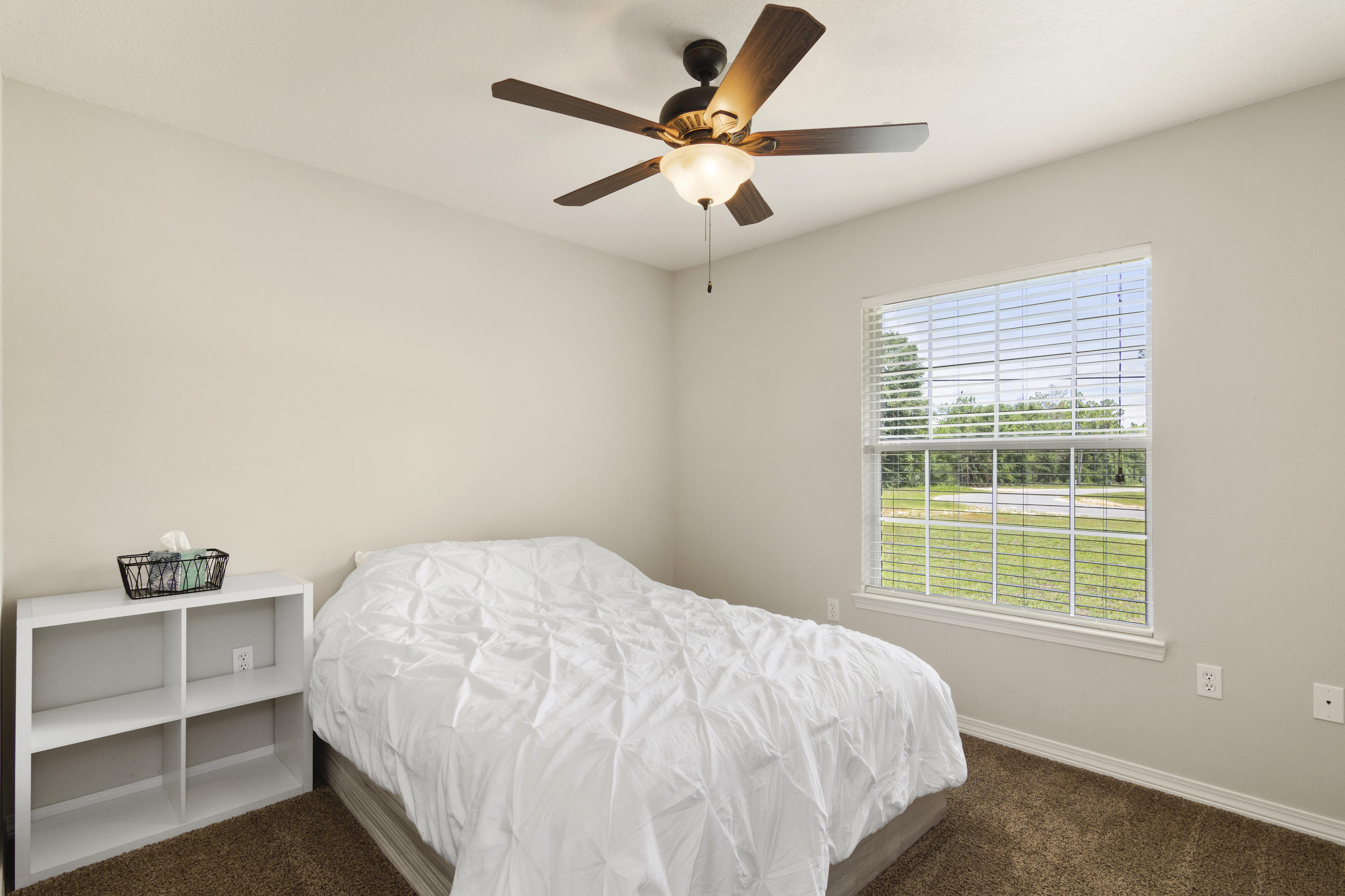 6336 Possum Ridge Road Crestview, FL 32539 - Photo 25 of 40 a bedroom with a bed and a window