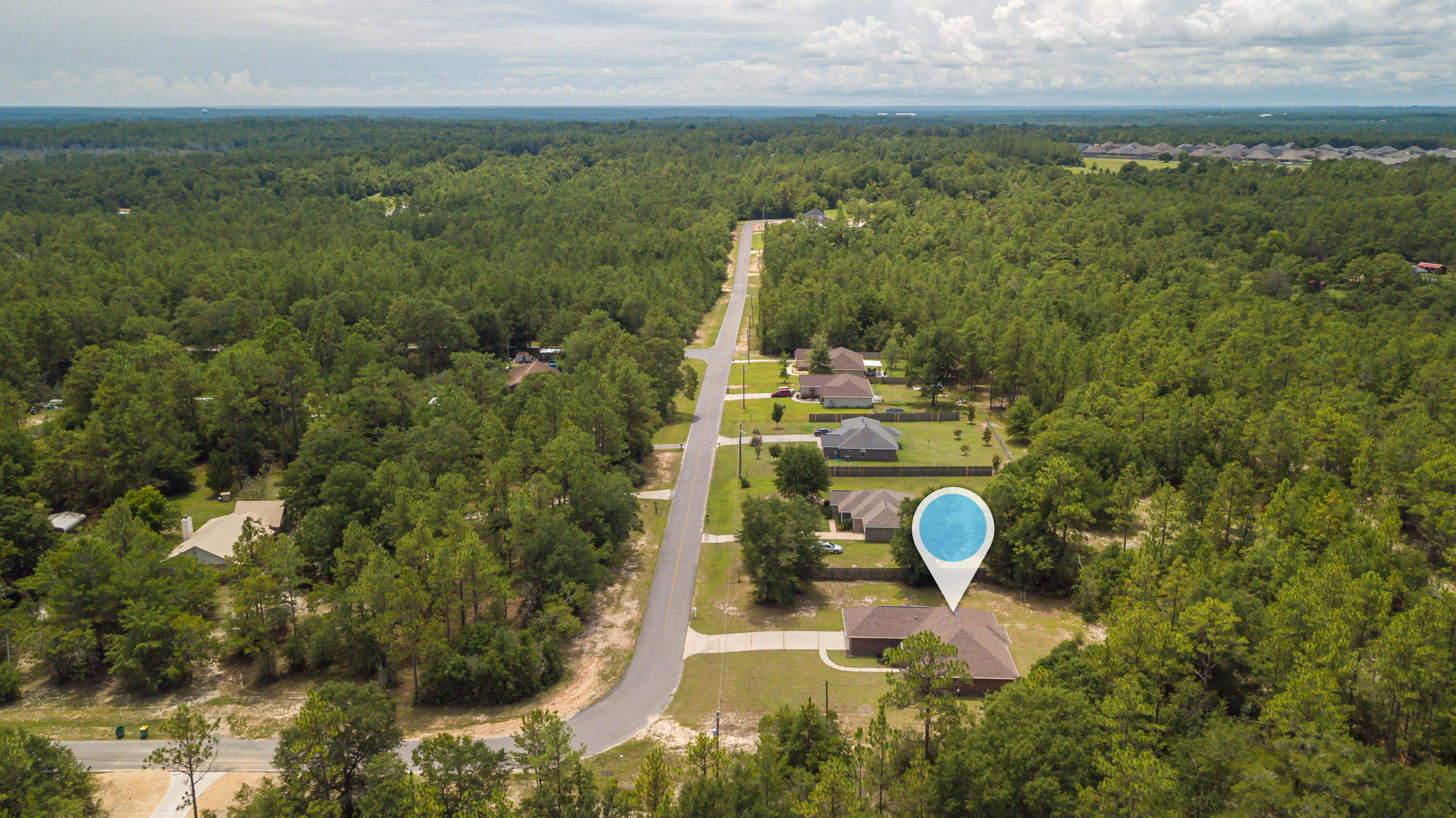 6336 Possum Ridge Road Crestview, FL 32539 - Photo 37 of 40 a aerial view of a house with a yard