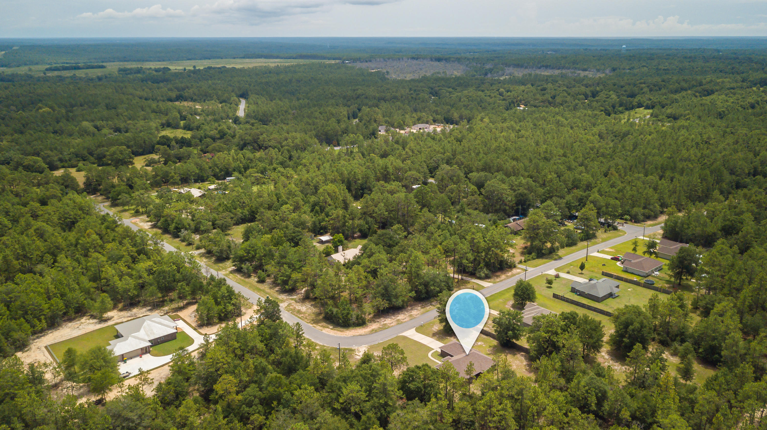 6336 Possum Ridge Road Crestview, FL 32539 - Photo 38 of 40 an aerial view of a house with a yard