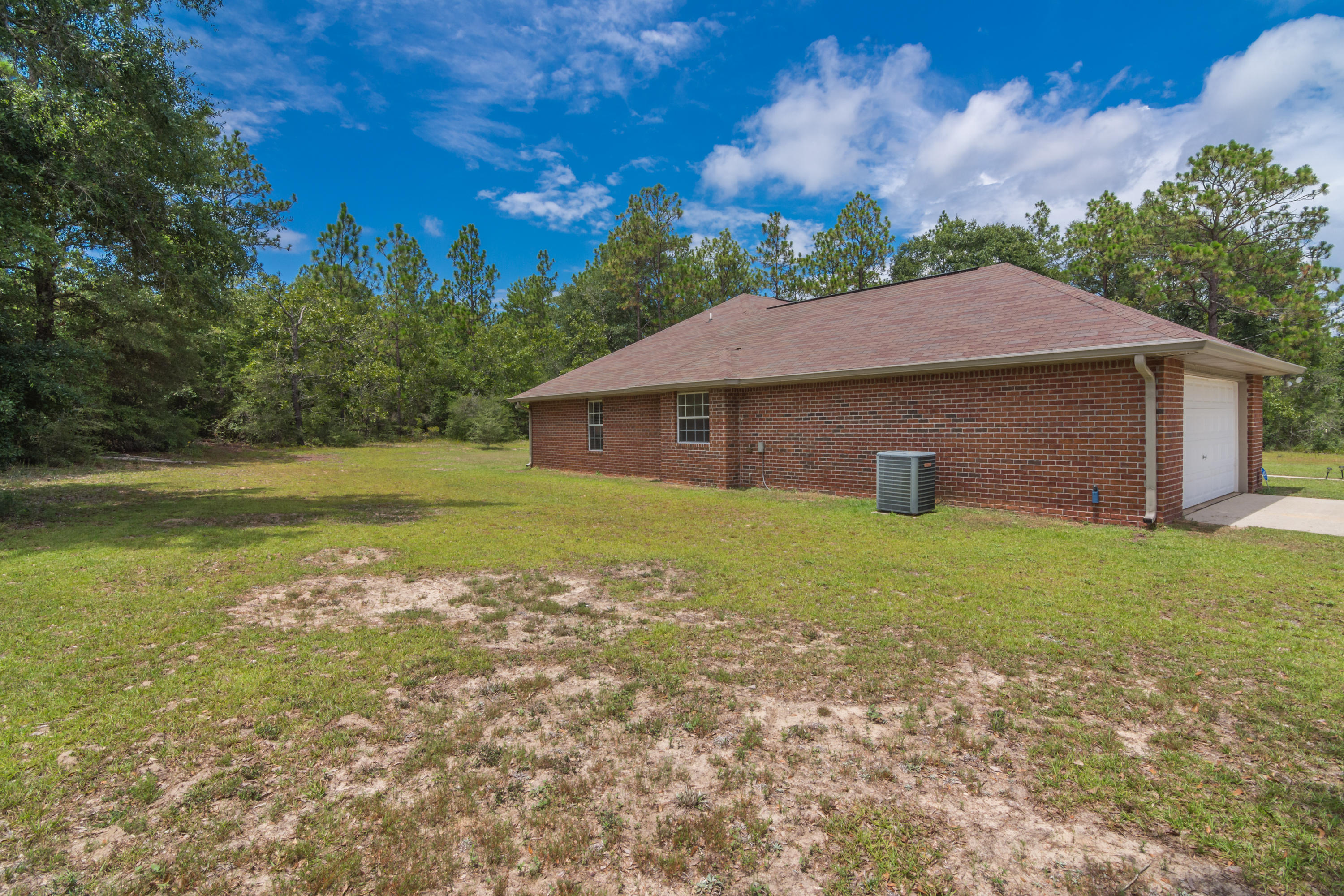 6336 Possum Ridge Road Crestview, FL 32539 - Photo 4 of 40 a view of a house with a yard