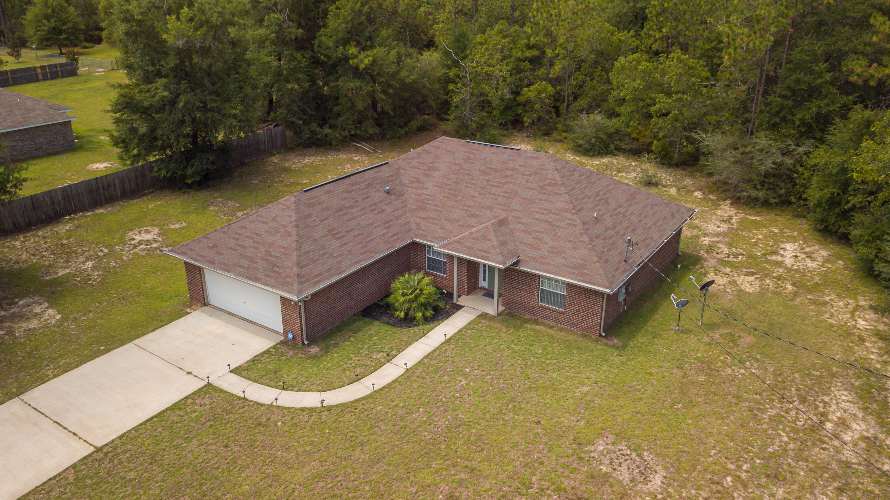 6336 Possum Ridge Road Crestview, FL 32539 - Photo 6 of 40 a aerial view of a house with a yard