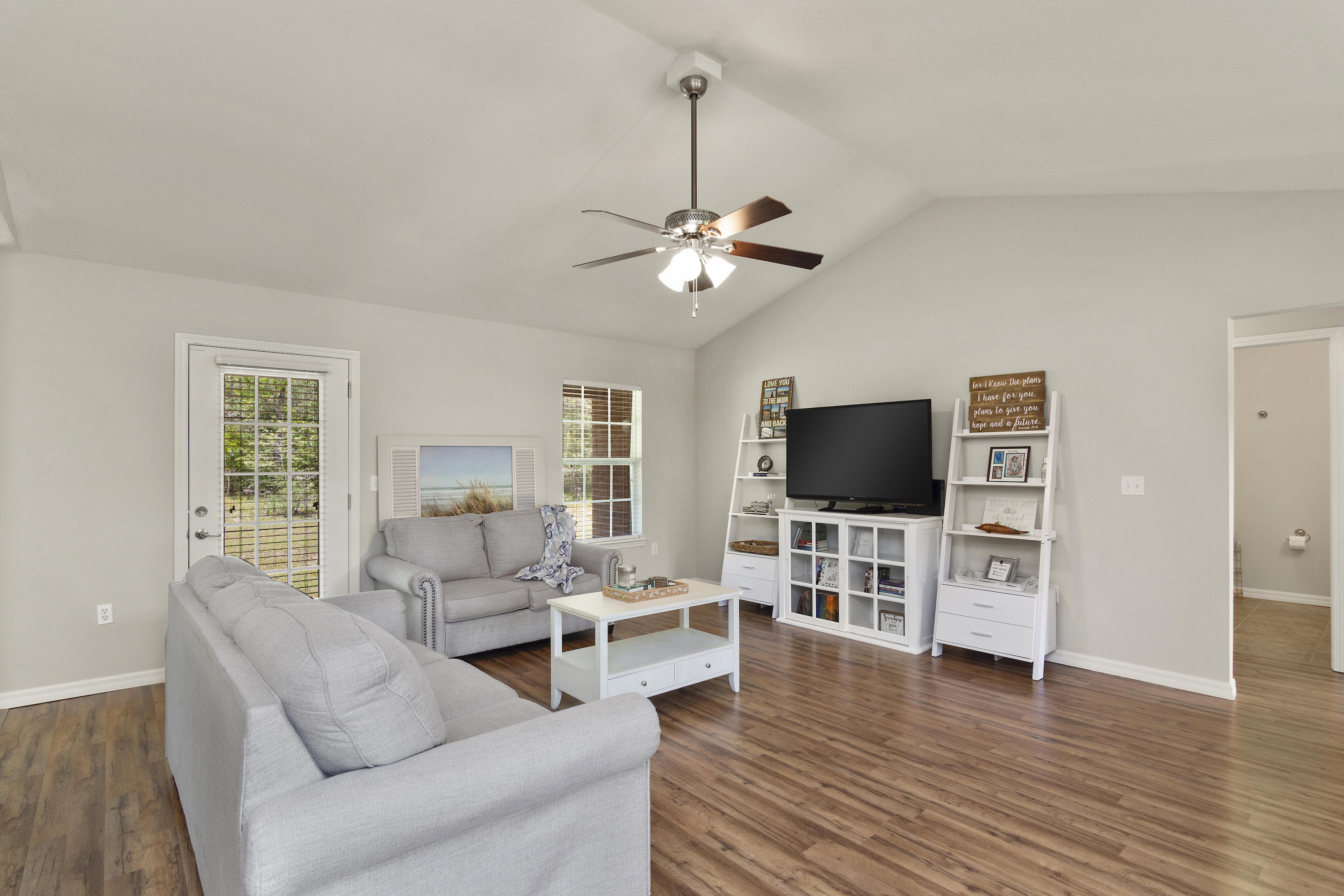 6336 Possum Ridge Road Crestview, FL 32539 - Photo 10 of 40 a living room with furniture and a flat screen tv