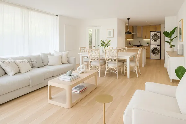 a living room with furniture and a dining table with kitchen view