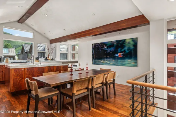 a kitchen with granite countertop a sink and a stove top oven
