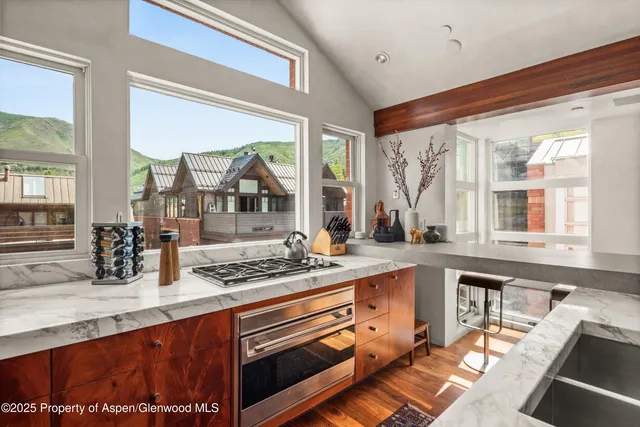 a bathroom with tub sink and mirror