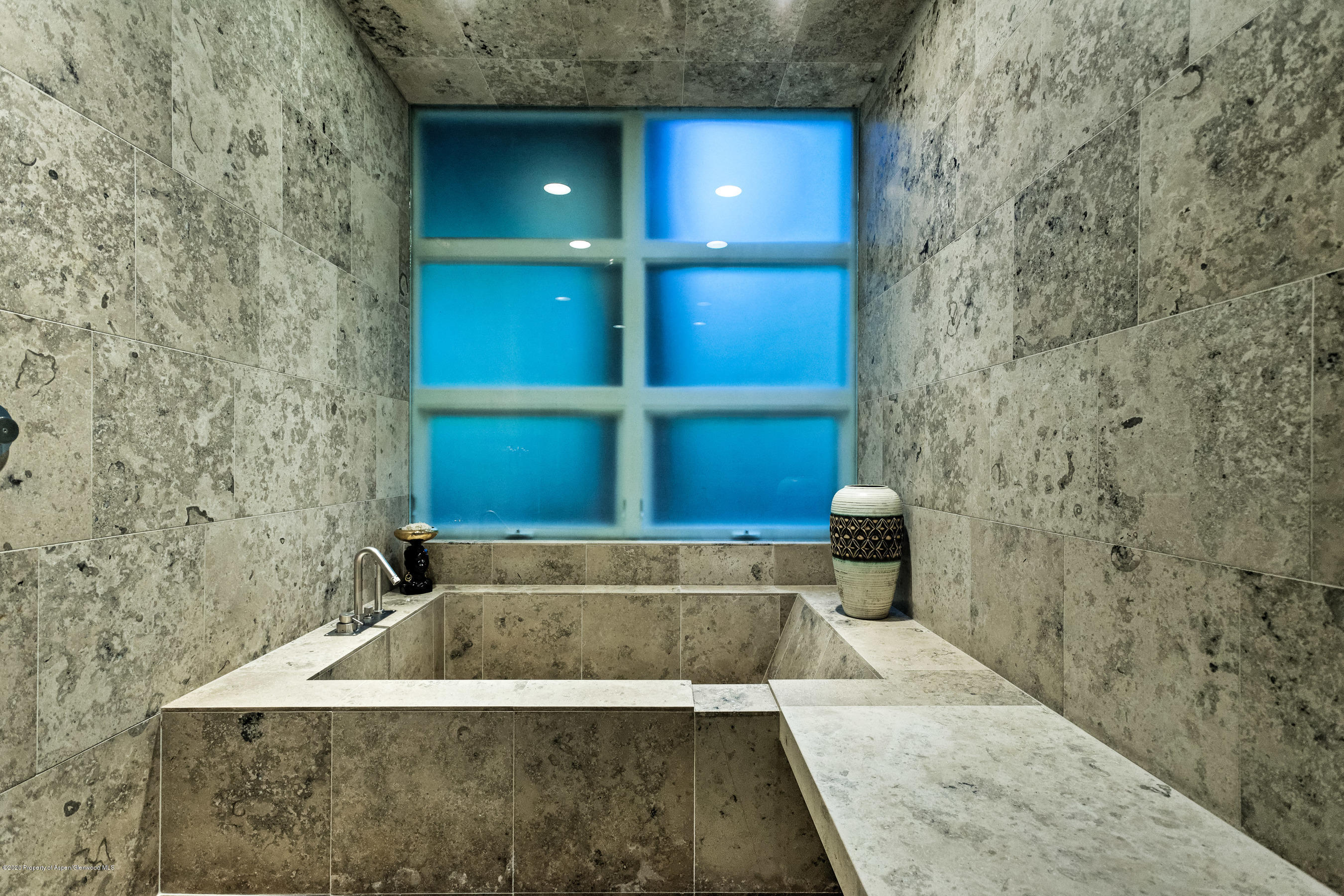 706 East Hyman Avenue, Unit 706 Aspen, CO 81611 - Photo 29 of 46 a bathroom with a bathtub and shower