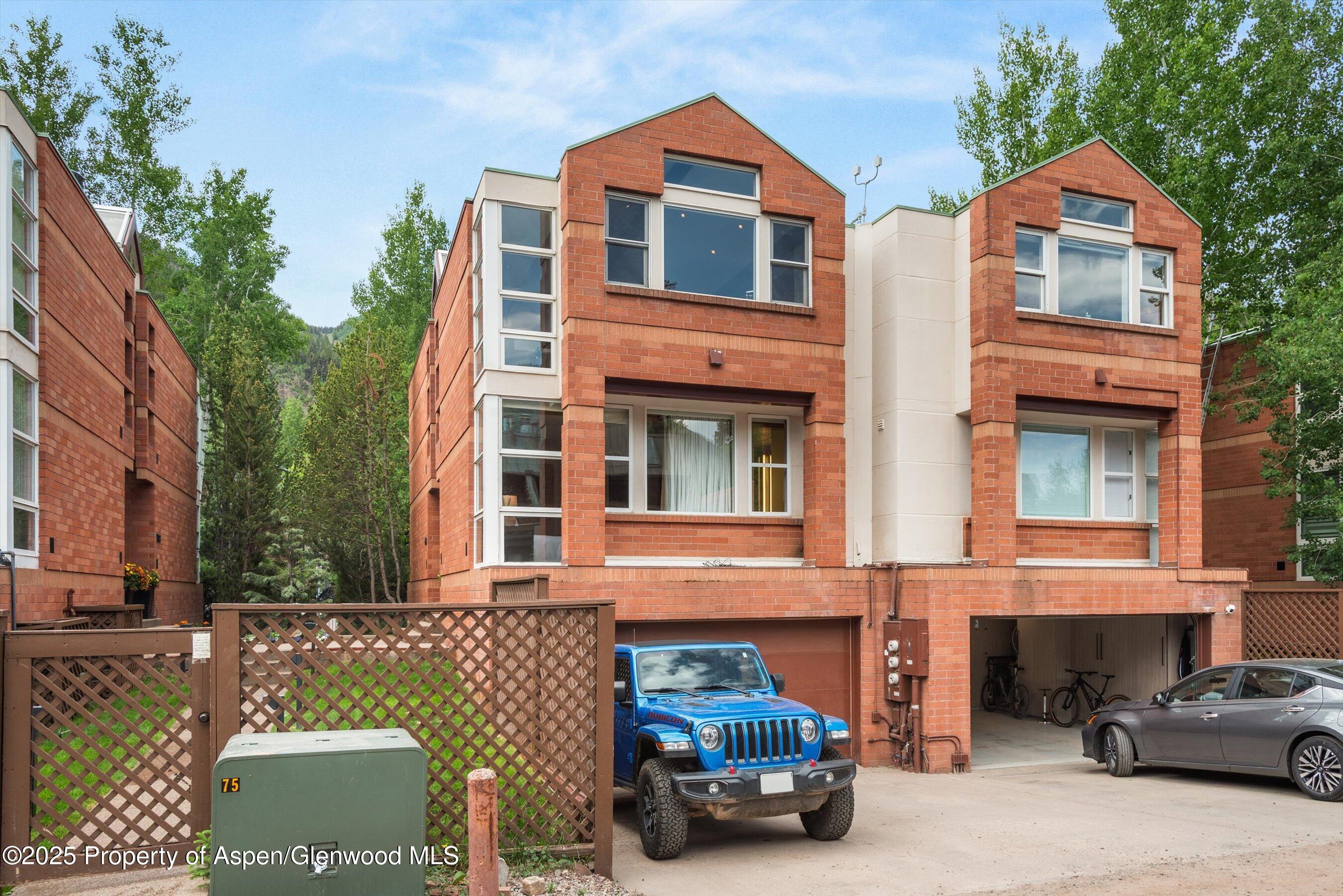 706 East Hyman Avenue, Unit 706 Aspen, CO 81611 - Photo 45 of 46 a view of a car parked in front of a house