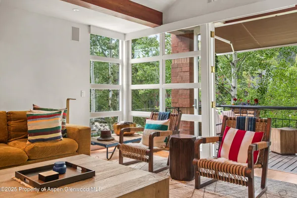 a view of a two chairs in the balcony