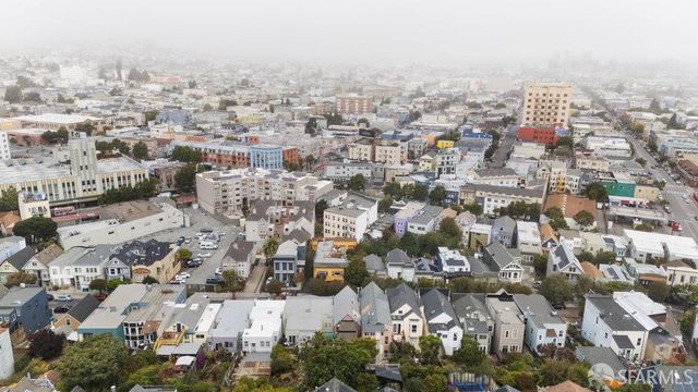 an aerial view of residential building with parking space