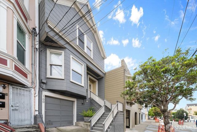a view of a building with a tree