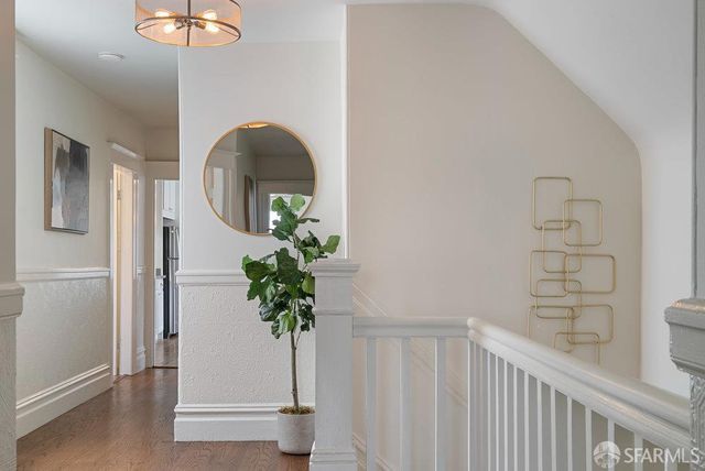 a vase of flowers sitting on a table near a window