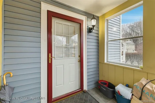 a view of a room that has a bed and a window