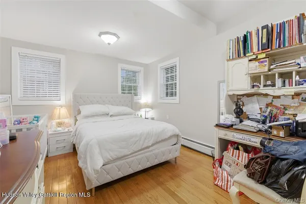 a bedroom with a bed and a book shelf